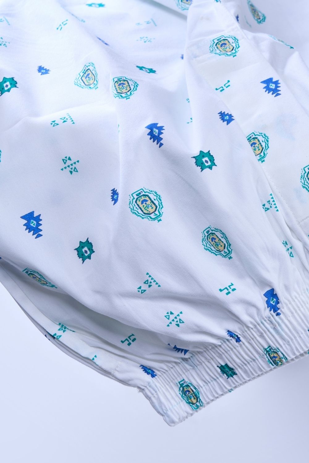 White colored all over printed cotton boxer for men with Side pockets, product close up.