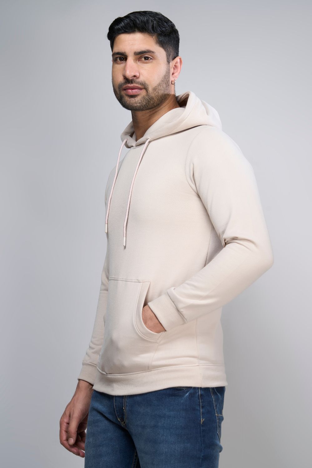 Soft Beige colored, hoodie for men with full sleeves and relaxed fit, pocket view.