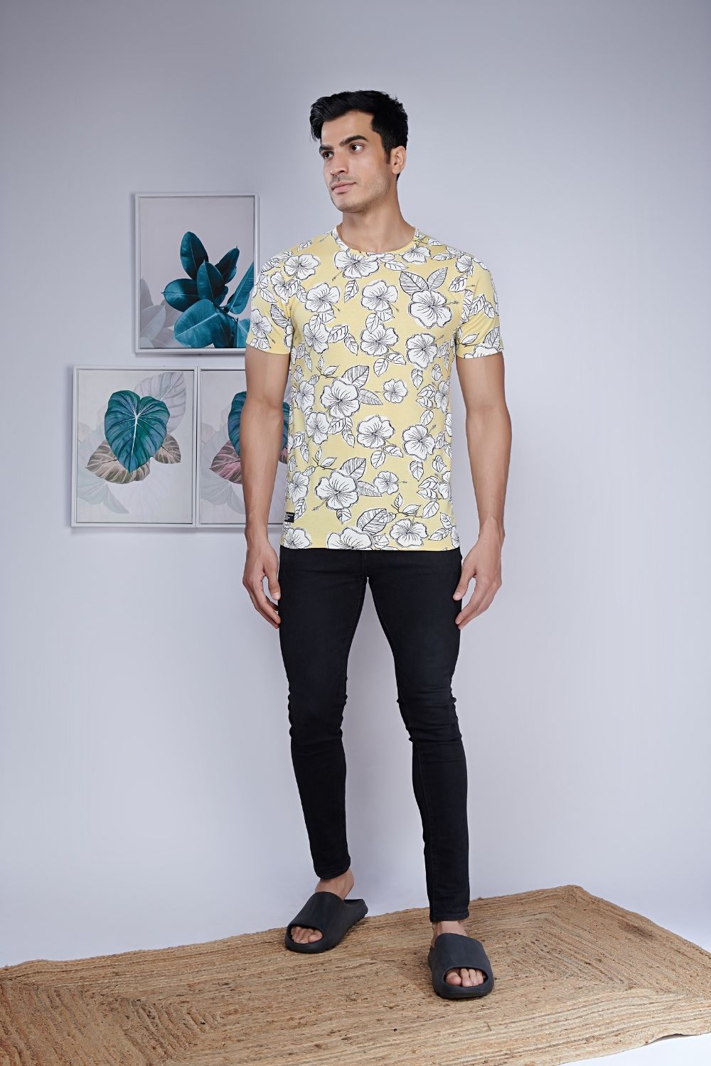 Direction style, floral patterned all over print T shirt for men with half sleeves and round neck, front view.
