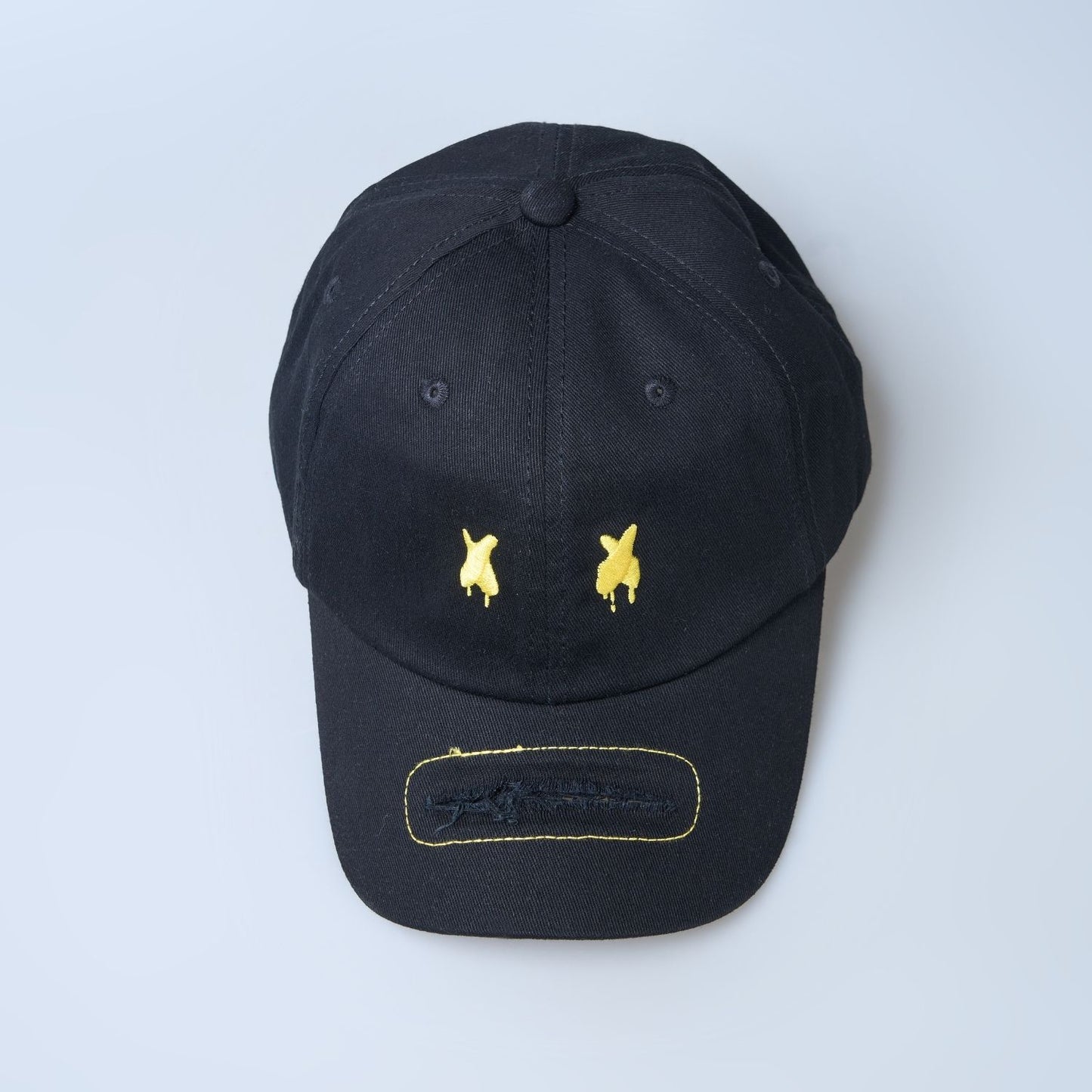 Table-top view of Black colored solid basic cap for men.