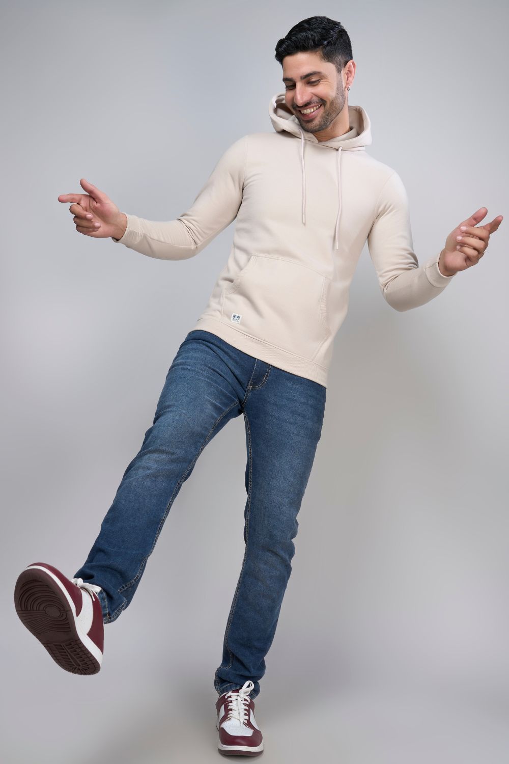Soft Beige colored, hoodie for men with full sleeves and relaxed fit.