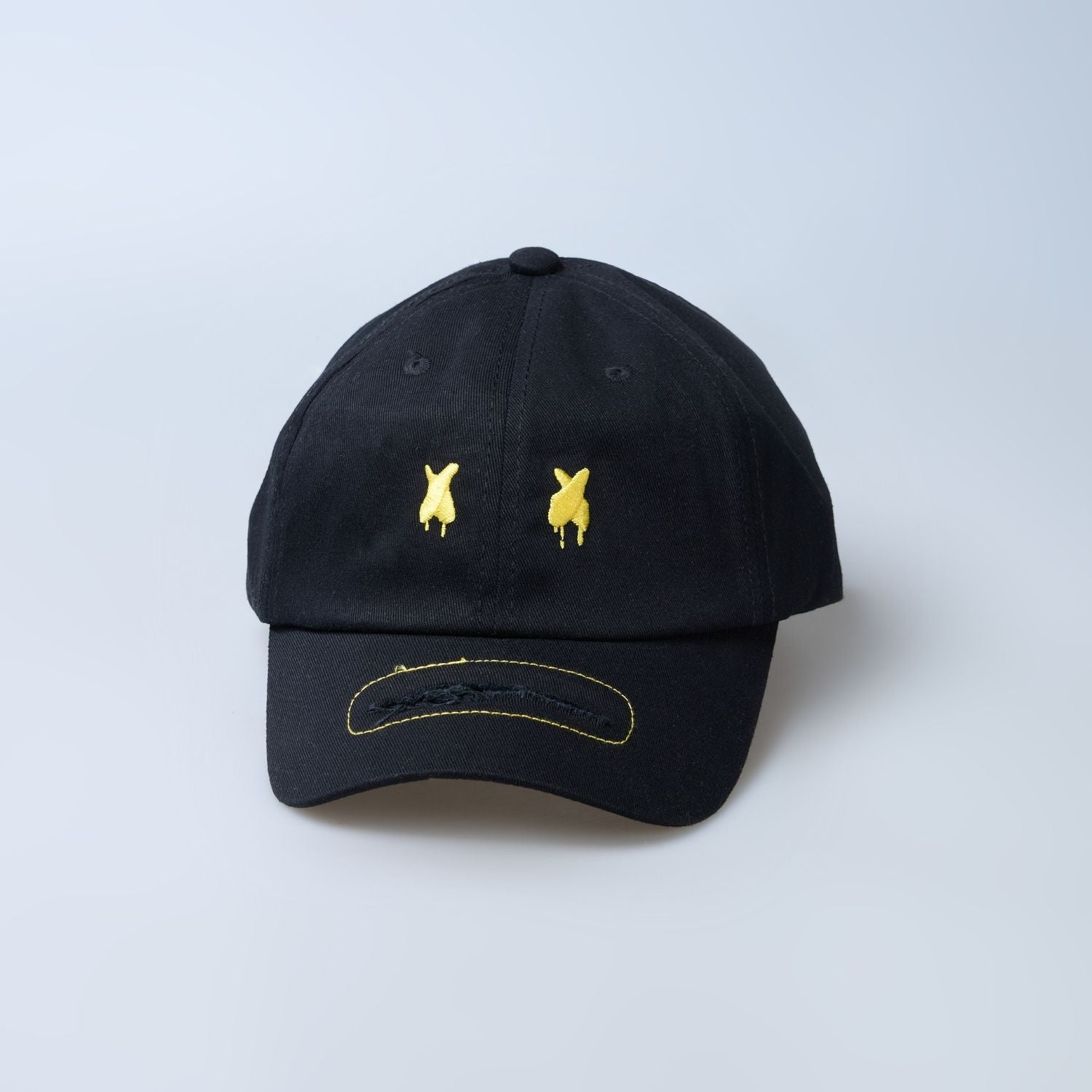 Front view of Black colored solid basic cap for men.