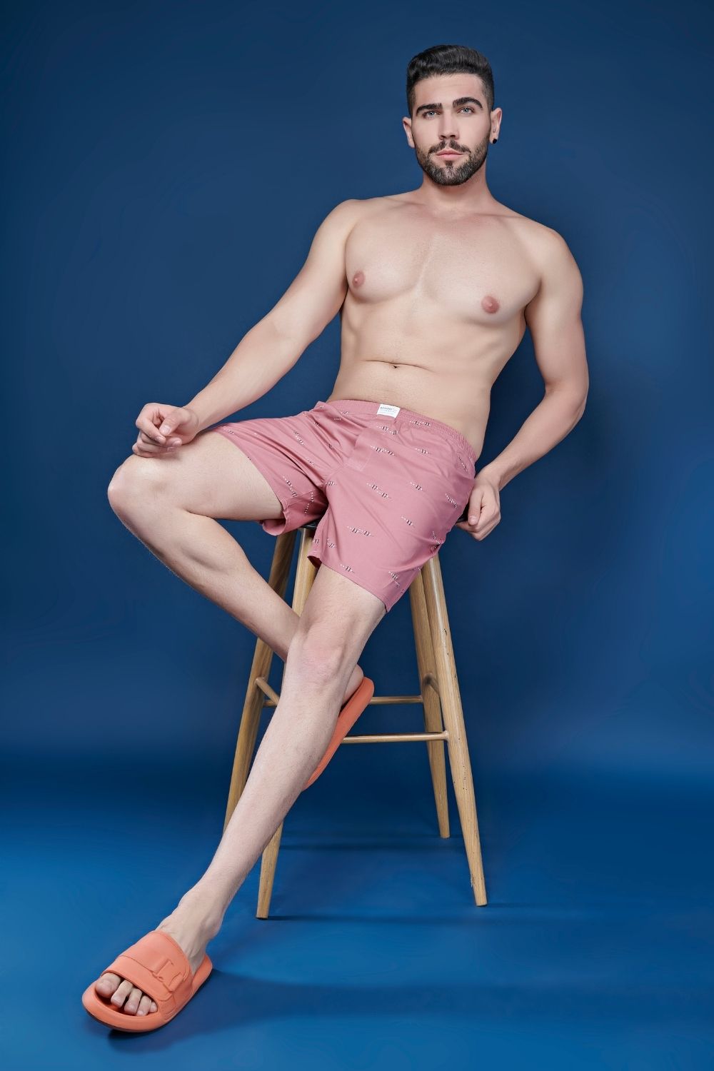 Pink colored all over printed cotton boxer for men with back pockets.