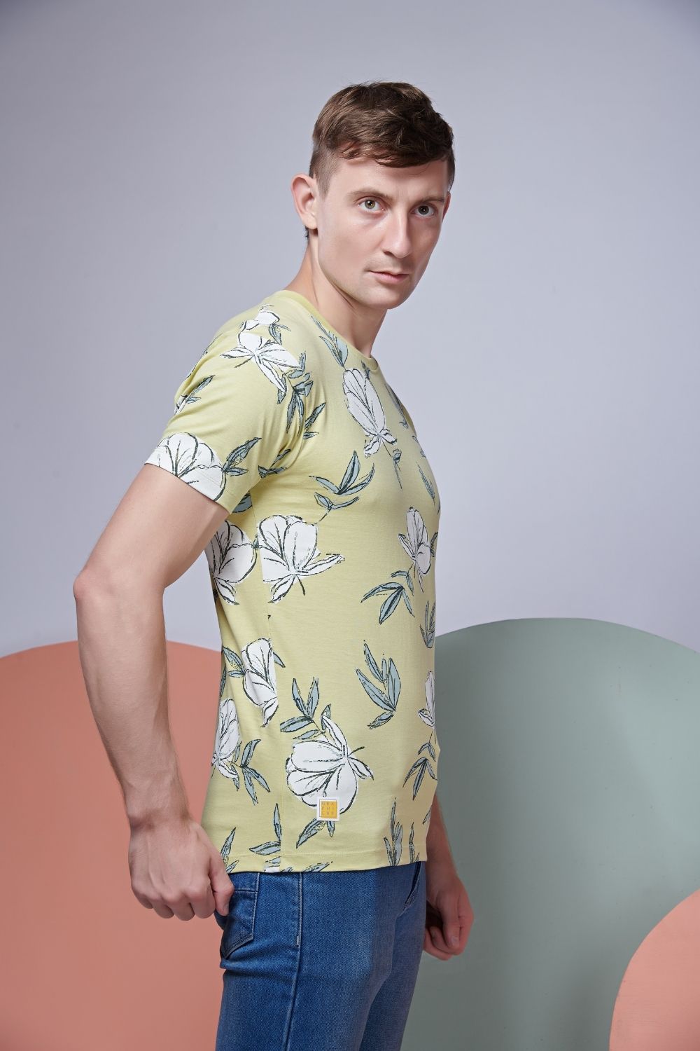 Side view of Pale rose style all over print T shirt for men with short sleeves and round neck.