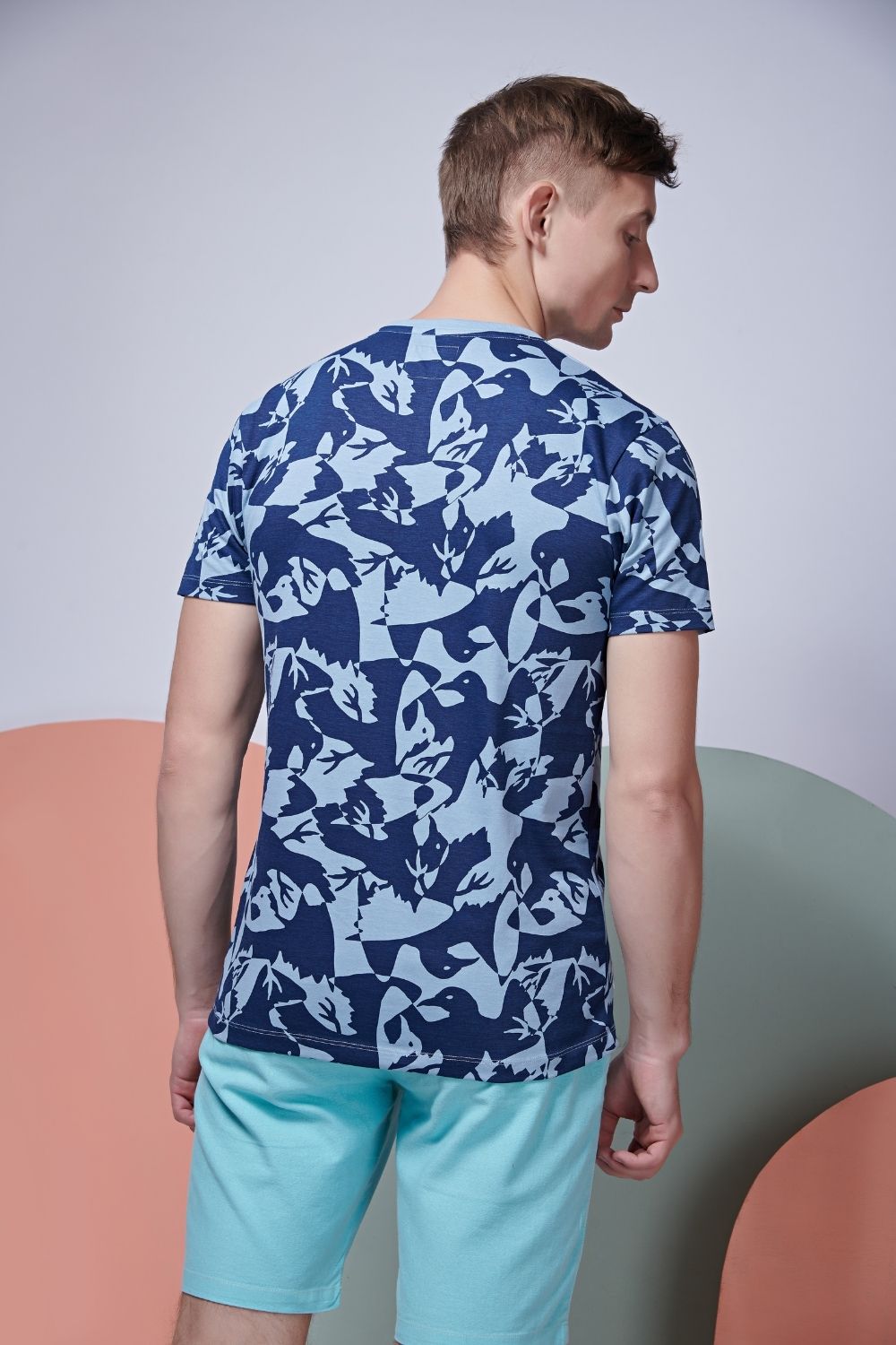 Back view of Bird patterned, all over print T shirt for men with half sleeves and round neck.