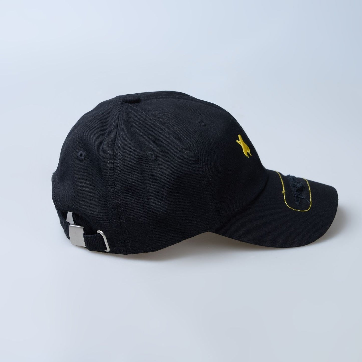 Side view of Black colored solid cap for men.
