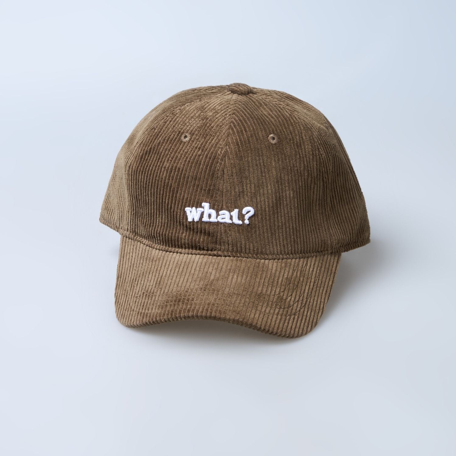 Brown colored cap for men with 'what' text written on it, front view.