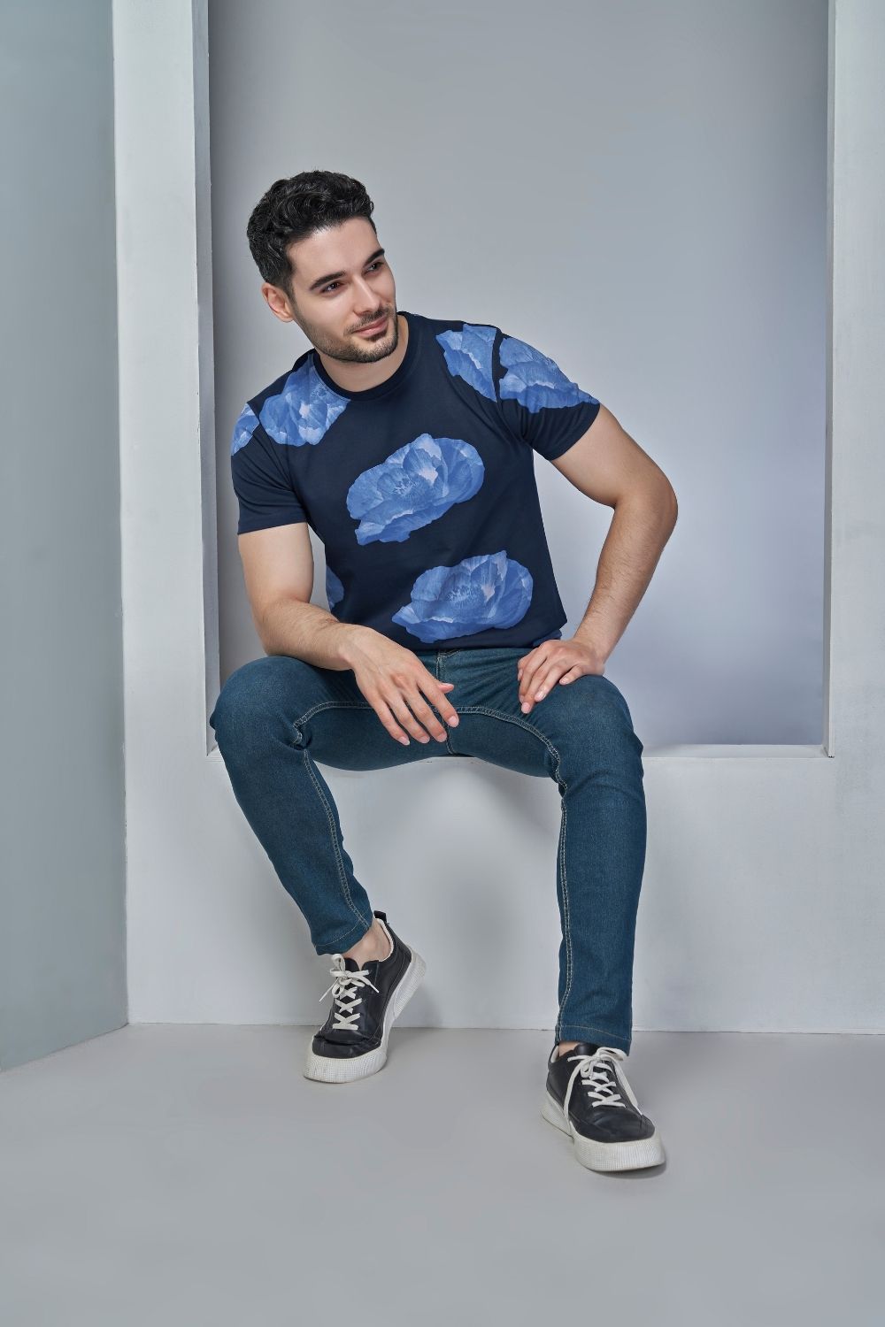 Royal Blue colored all over rose print T shirt for men with half sleeves and round neck.