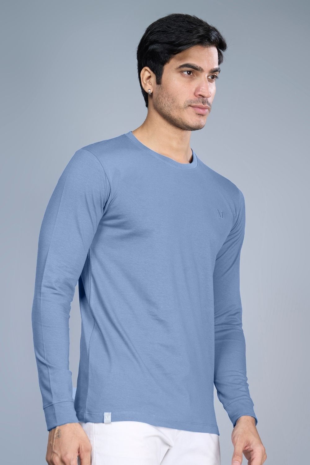 N. L. Blue colored, full sleeve solid T shirt for Men with round neck, side view.