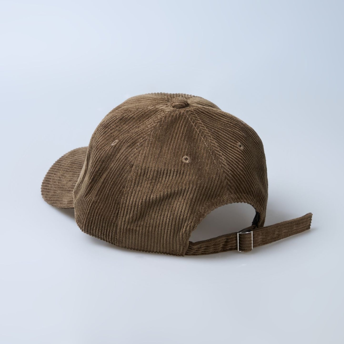 Brown colored cap for men with 'what' text written on it, back view.