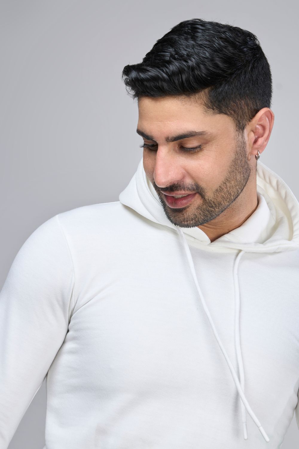 White colored, hoodie for men with full sleeves and relaxed fit, closeup.