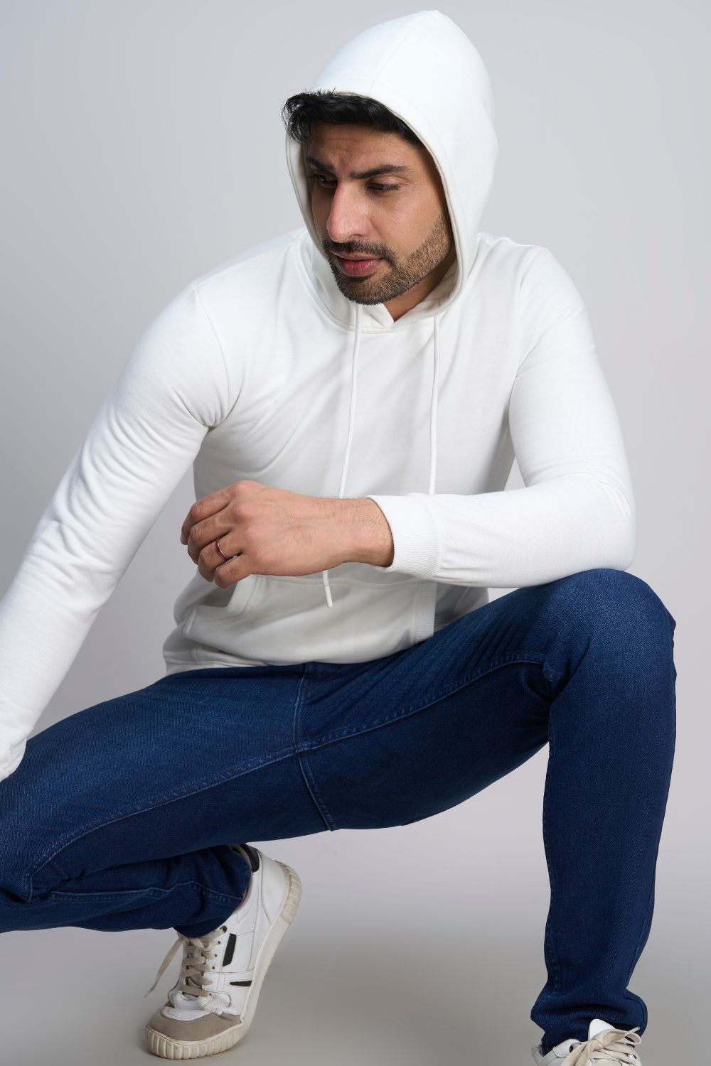 White colored, hoodie for men with full sleeves and relaxed fit.