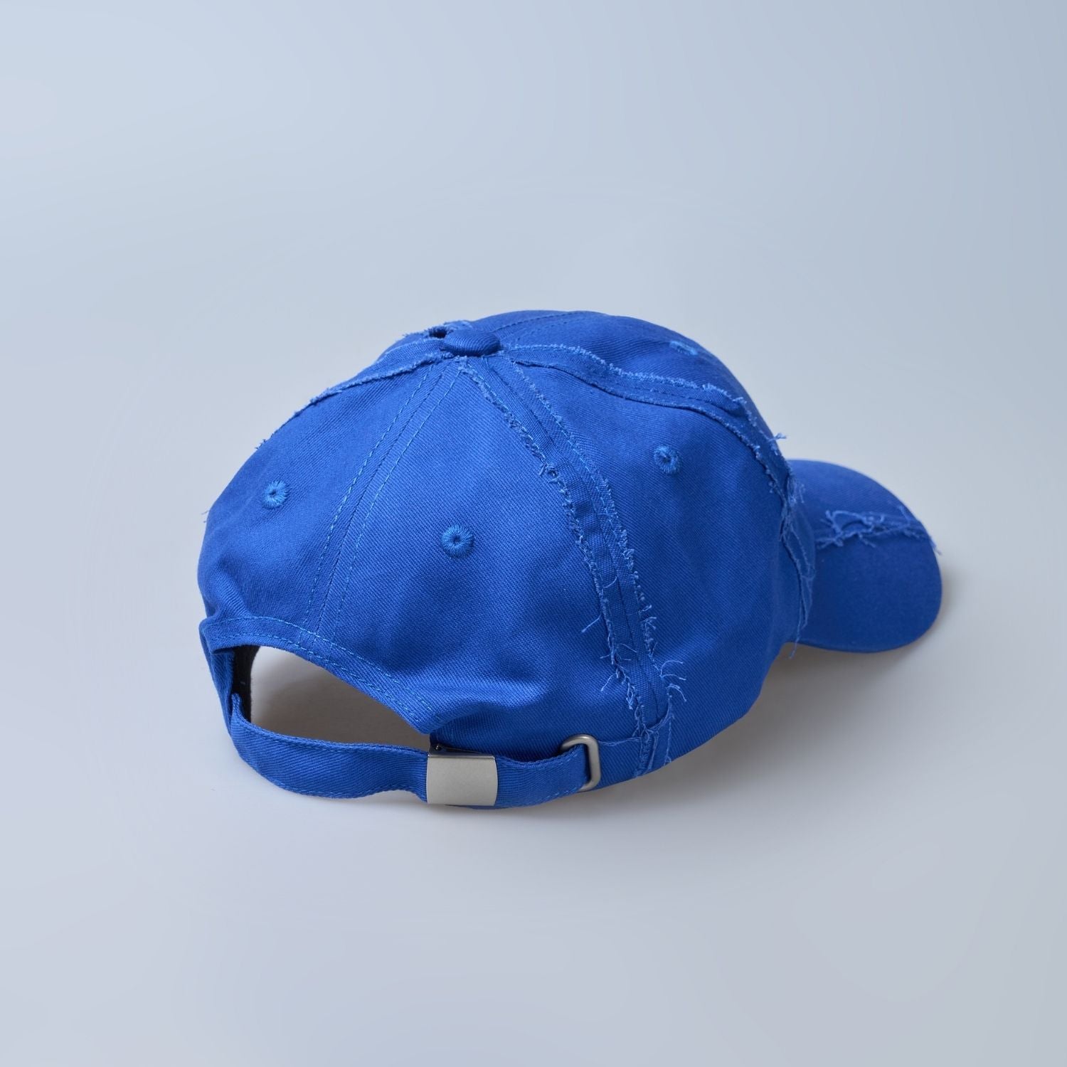 Blue colored, wide brim cap for men with adjustable strap, back view.