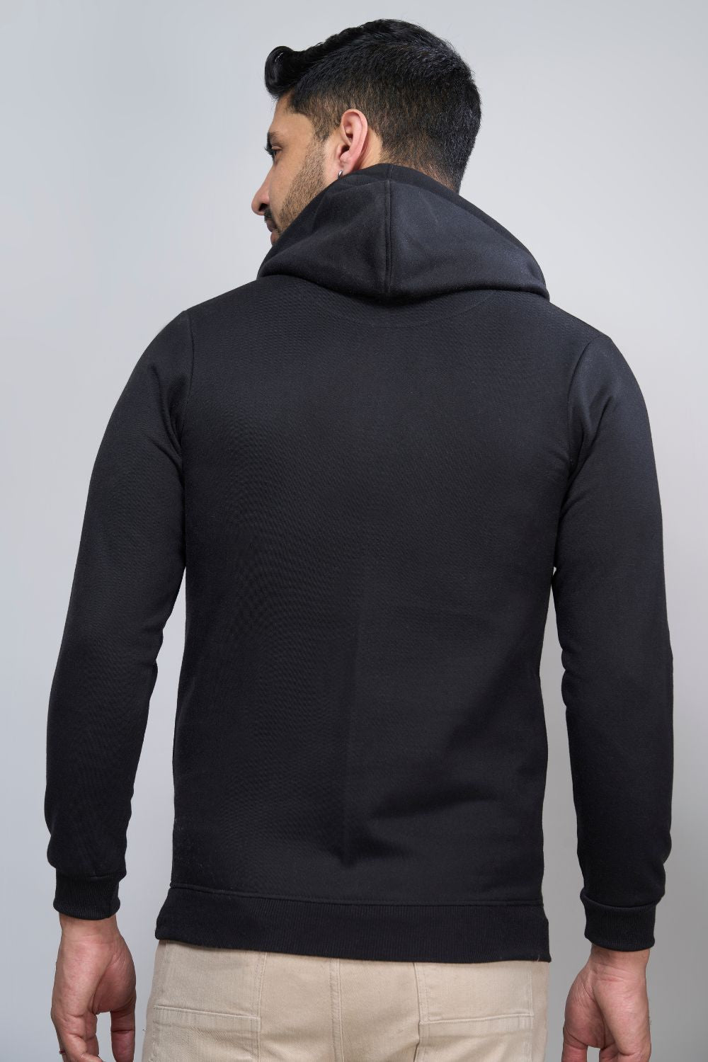 Black colored, hoodie for men with full sleeves and relaxed fit, Back view.