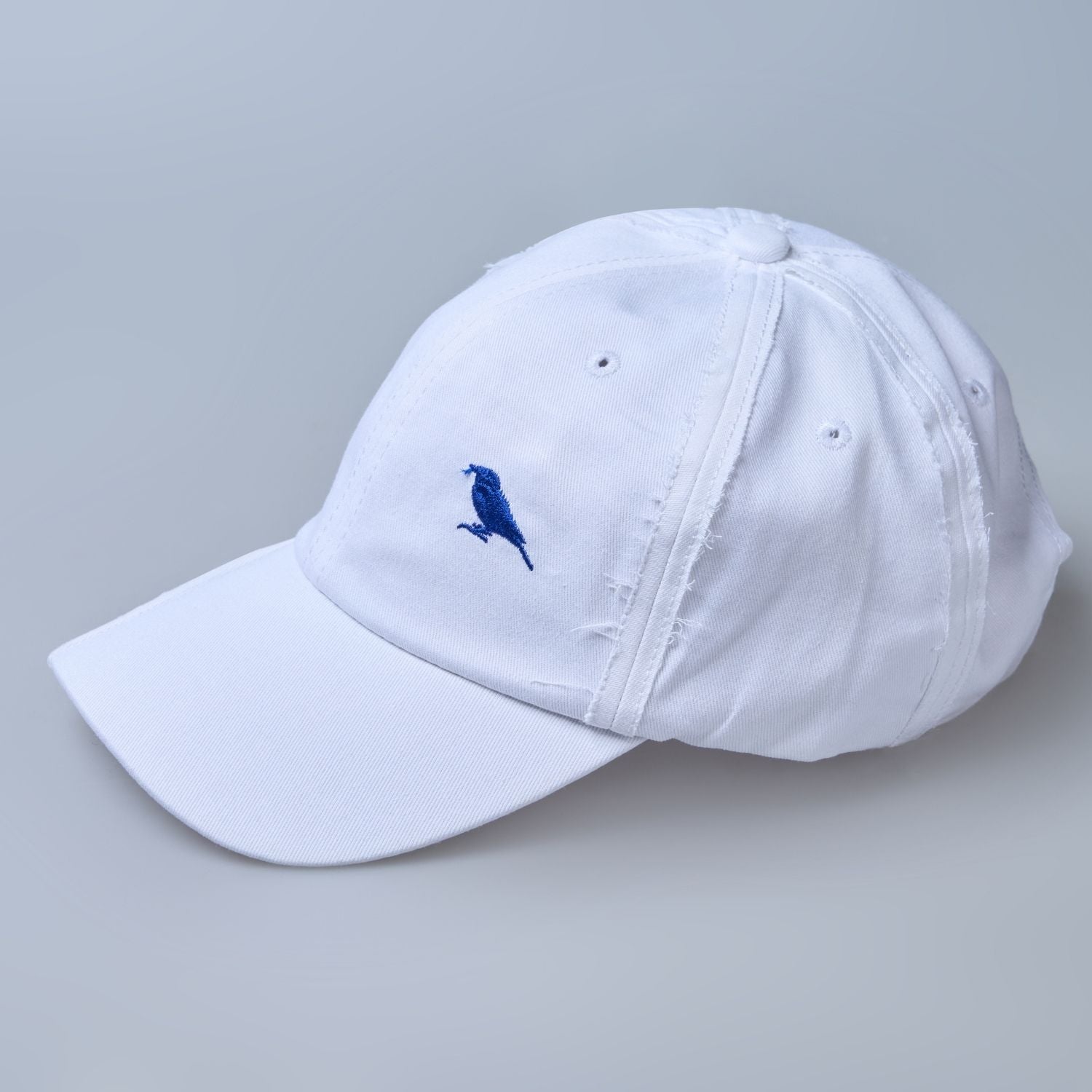 white colored, wide brim polo cap for men with adjustable strap, minimalistic side view.