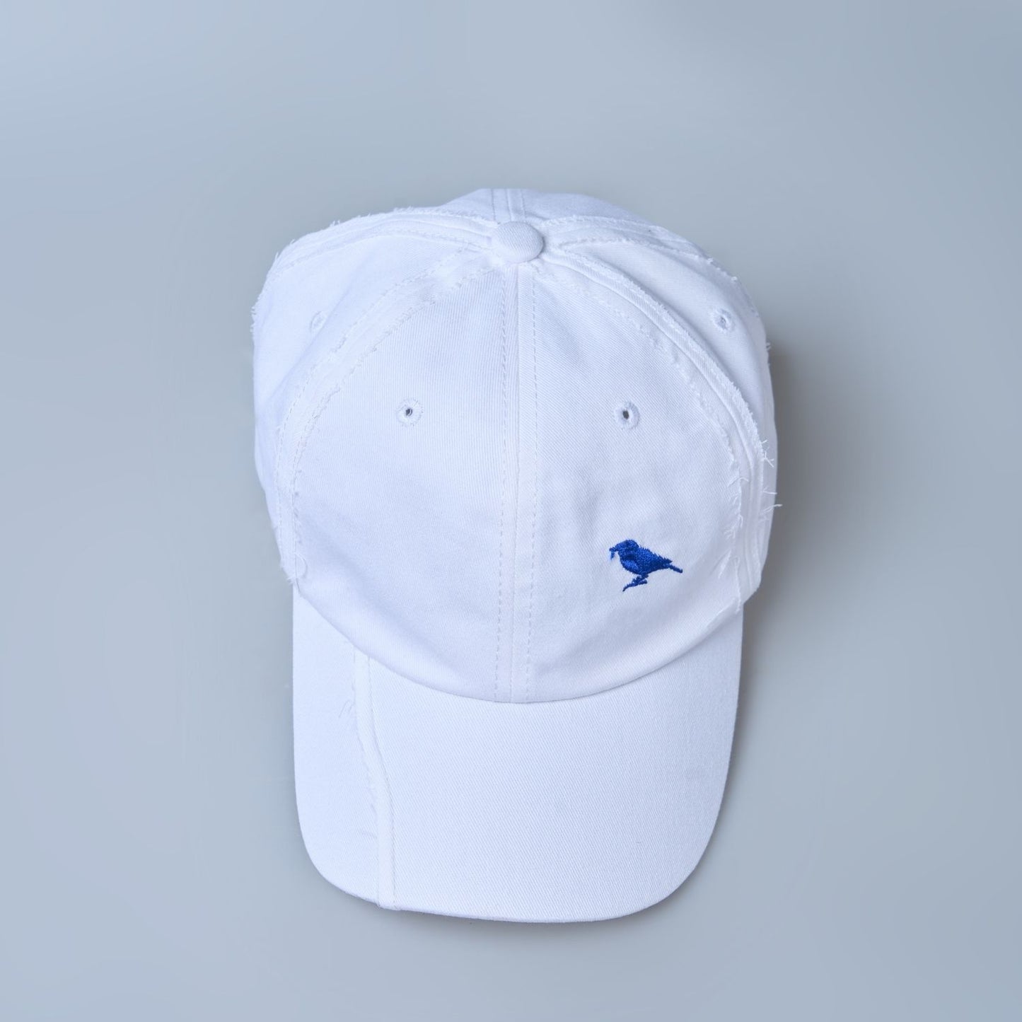 white colored, wide brim polo cap for men with adjustable strap, up view.