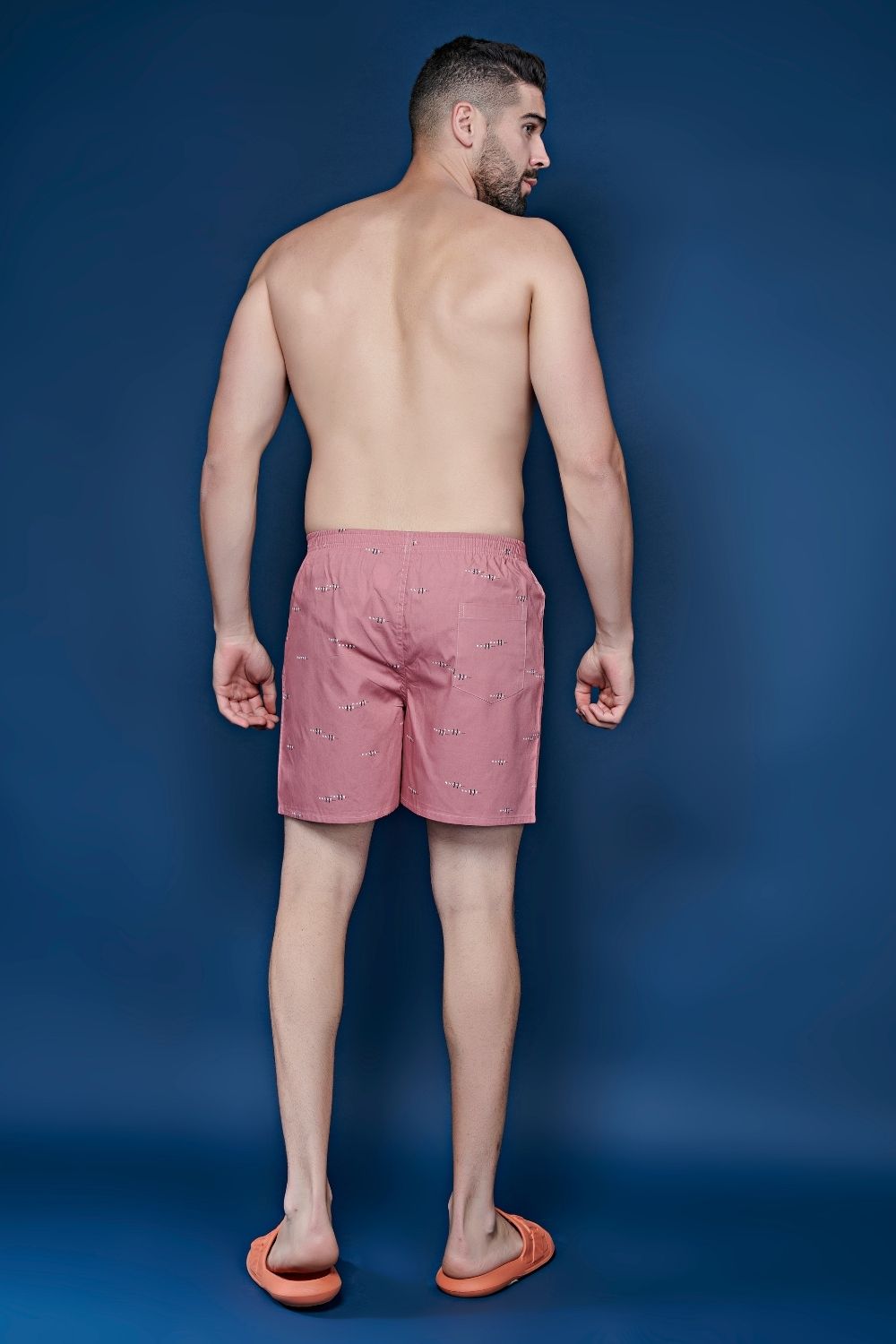 Pink colored all over printed cotton boxer for men with back pockets, back.