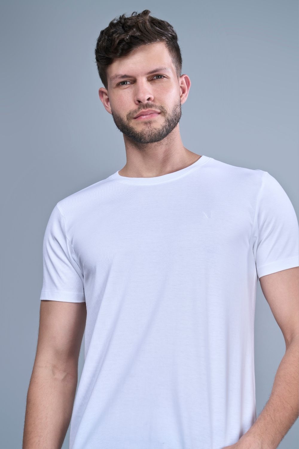 White colored, solid t shirt for men with round neck and half sleeves, close up.