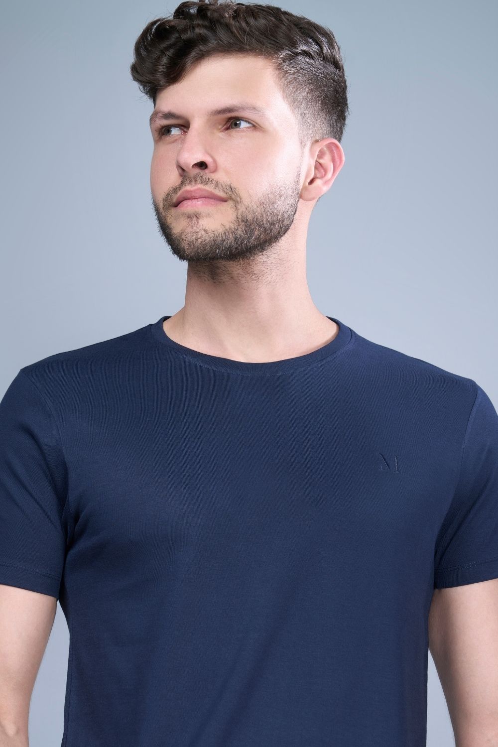 Teal Navy colored, solid t shirt for men with round neck and half sleeves, close up.