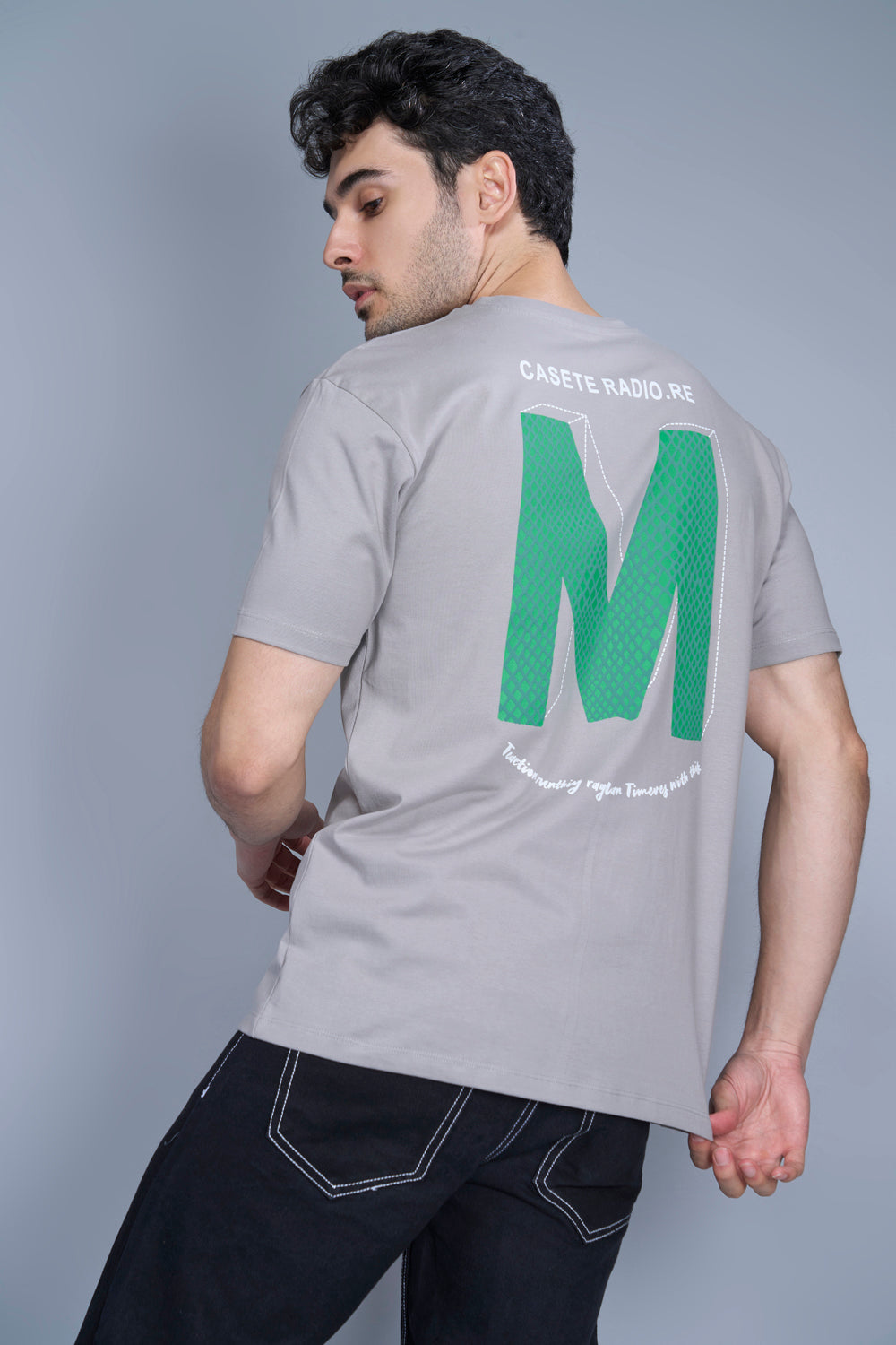 Cotton oversized T shirt for men in the solid color Vapour Blue with half sleeves and crew neck, back view.