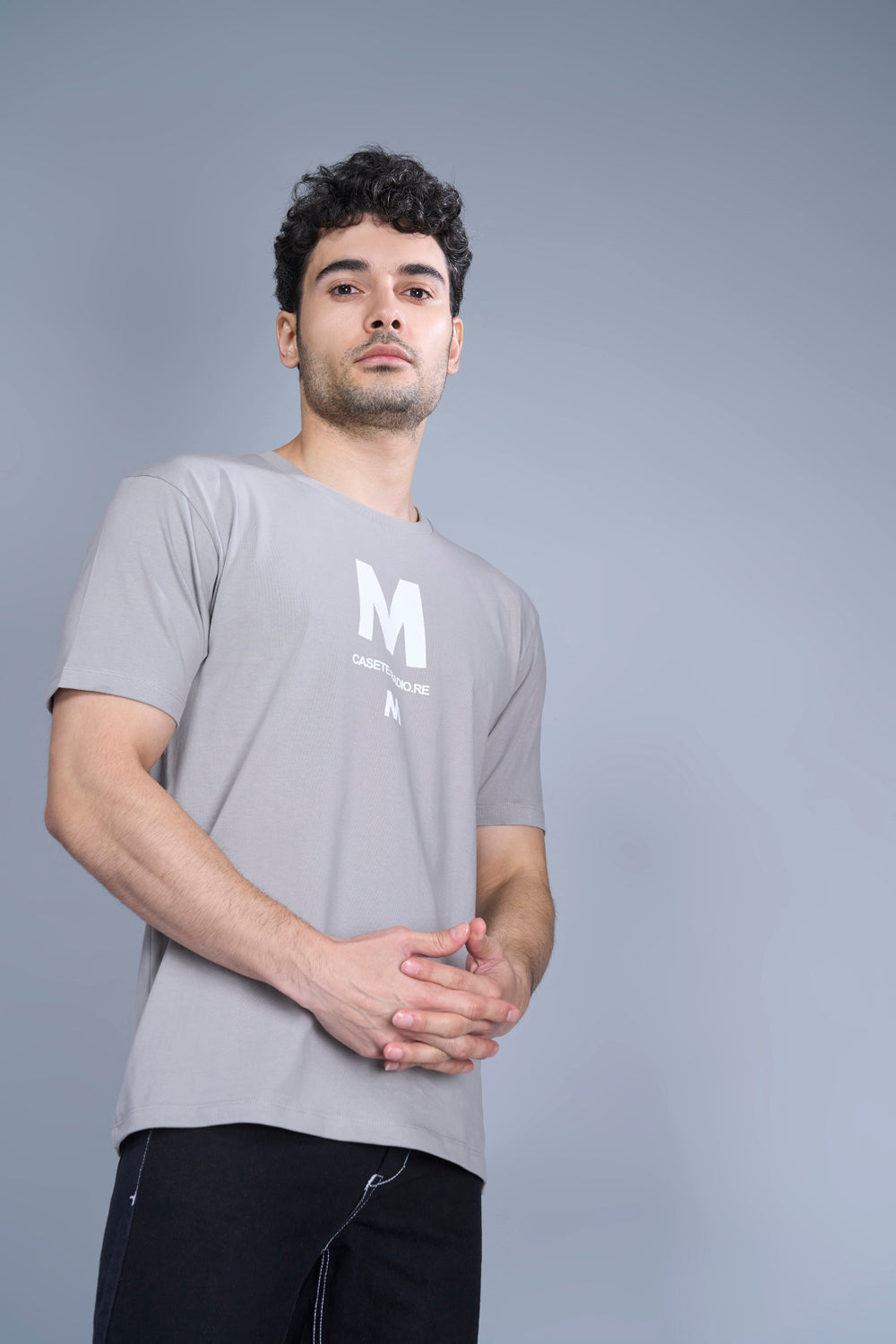 Cotton oversized T shirt for men in the solid color Vapour Blue with half sleeves and crew neck, side view.