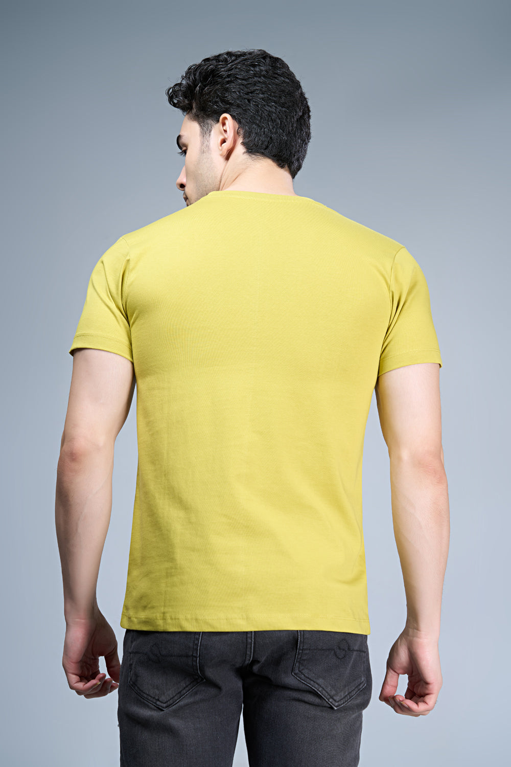 B. Yellow colored, cotton Graphic T shirt for men, half sleeves and round neck, back view.