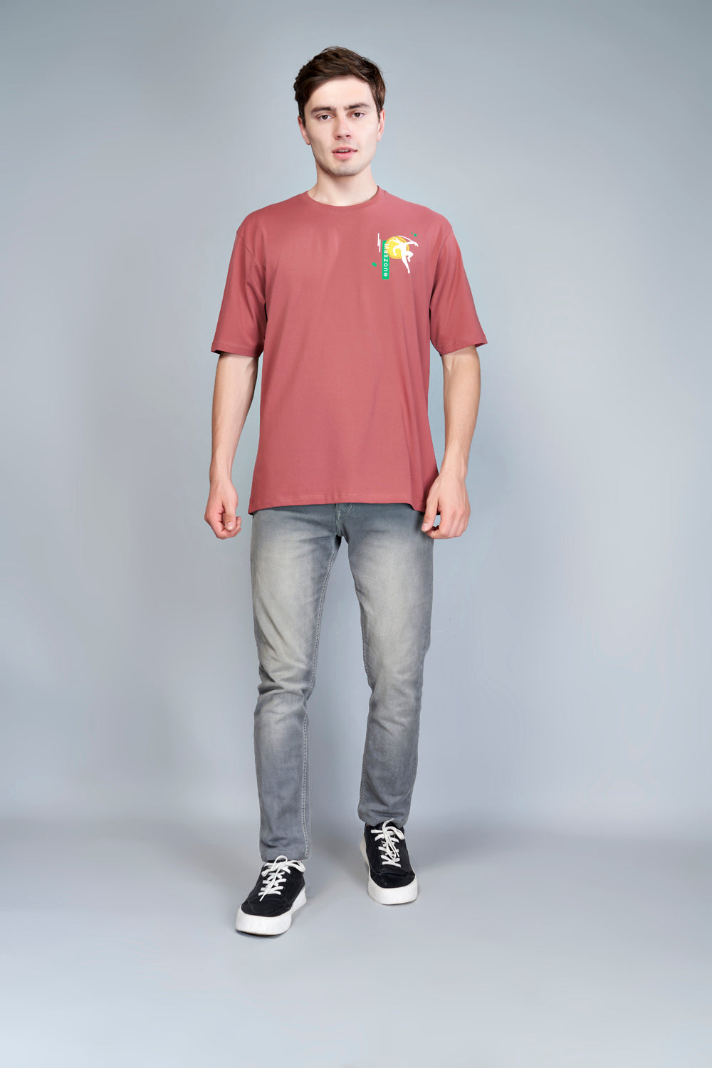 Cotton oversized T shirt for men in the solid color Rose Gold with half sleeves and crew neck, front view.