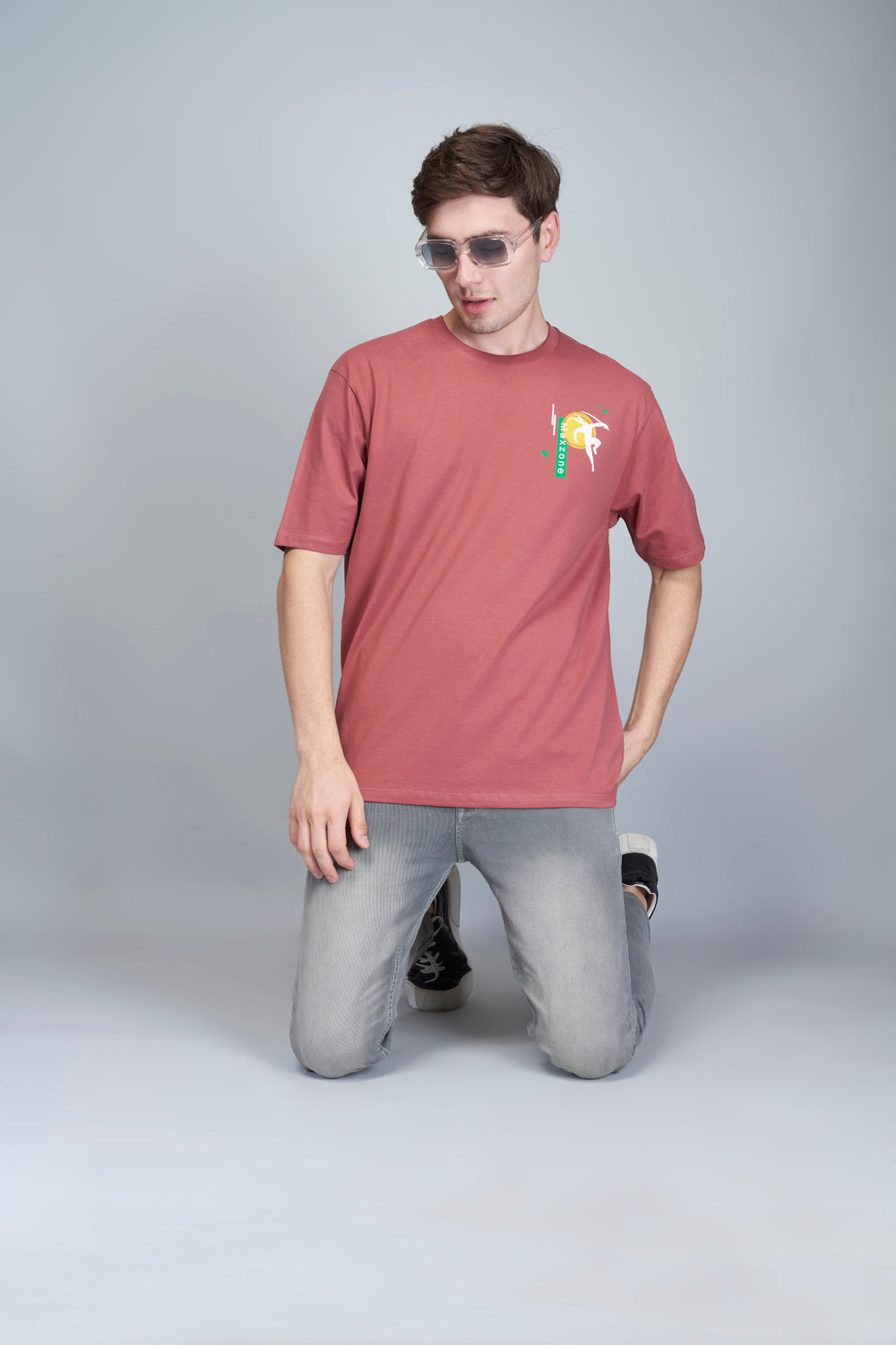 Cotton oversized T shirt for men in the solid color Rose Gold with half sleeves and crew neck.